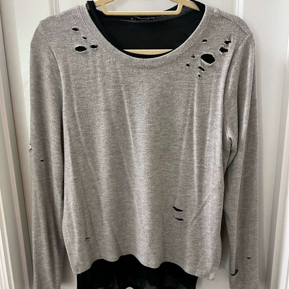 Soft grey distressed sweater with black lining